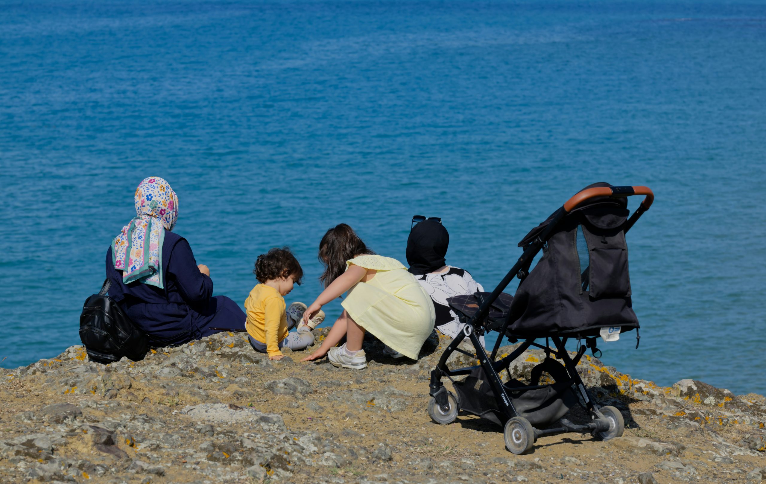 Stroller navigating uneven urban sidewalk
